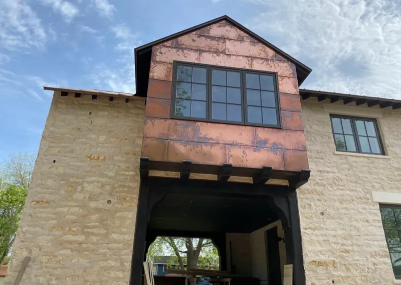 Copper metal panel facade on a stone building for Roof Repair in Camp Verde